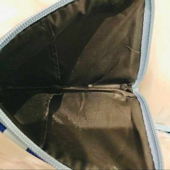 Lacoste Embossed Striped L-Zip Wristlet - Picture 6 of 7